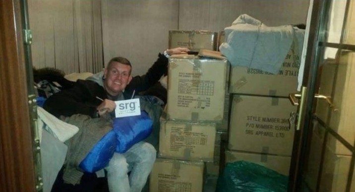 Scott among boxes of donated supplies for homeless outreach