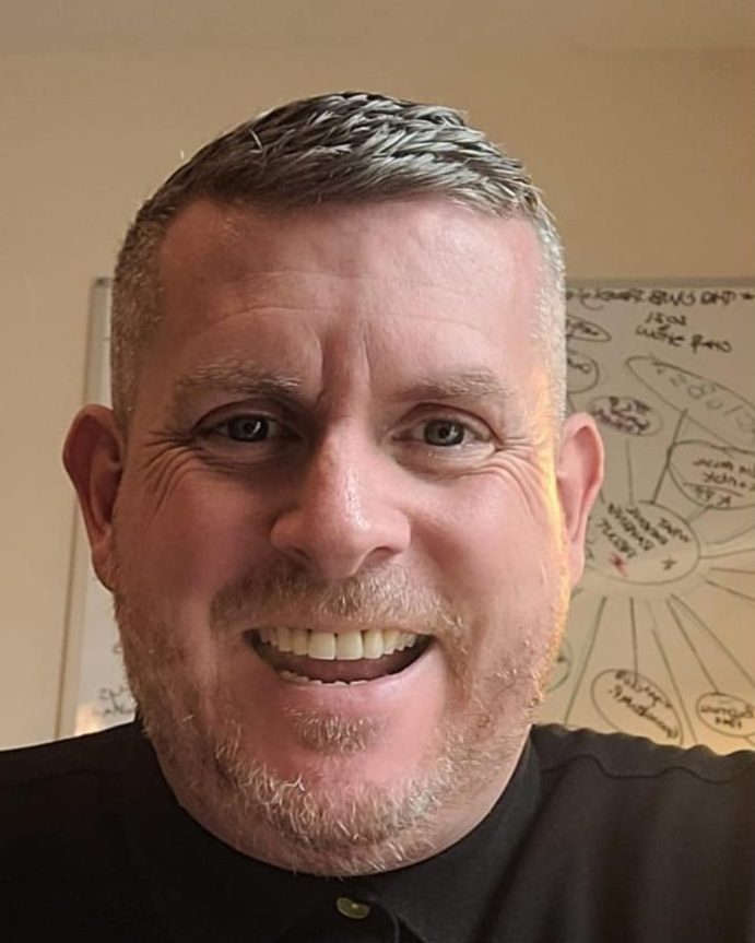 Scott Glover, founder of Social Legacy CIC, smiling to camera
