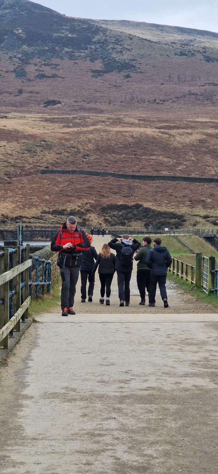 The walk-and-talk group walking a hillside path together
